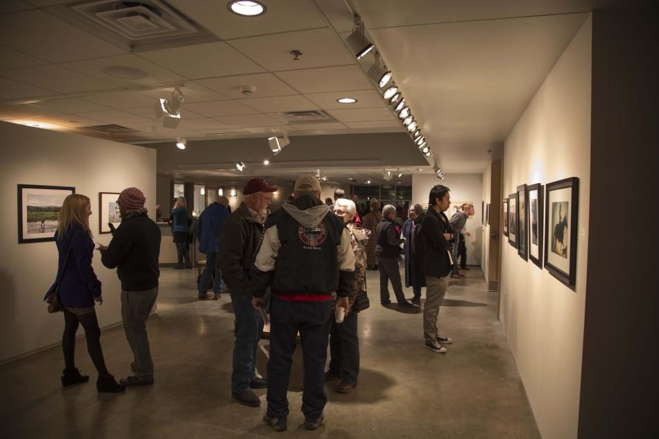 Group of People check out the submissions to the tenth annual Dahl Mountain Photo Exhibit on Feb. 7, at the Dahl Fine Arts Center in Rapid City.