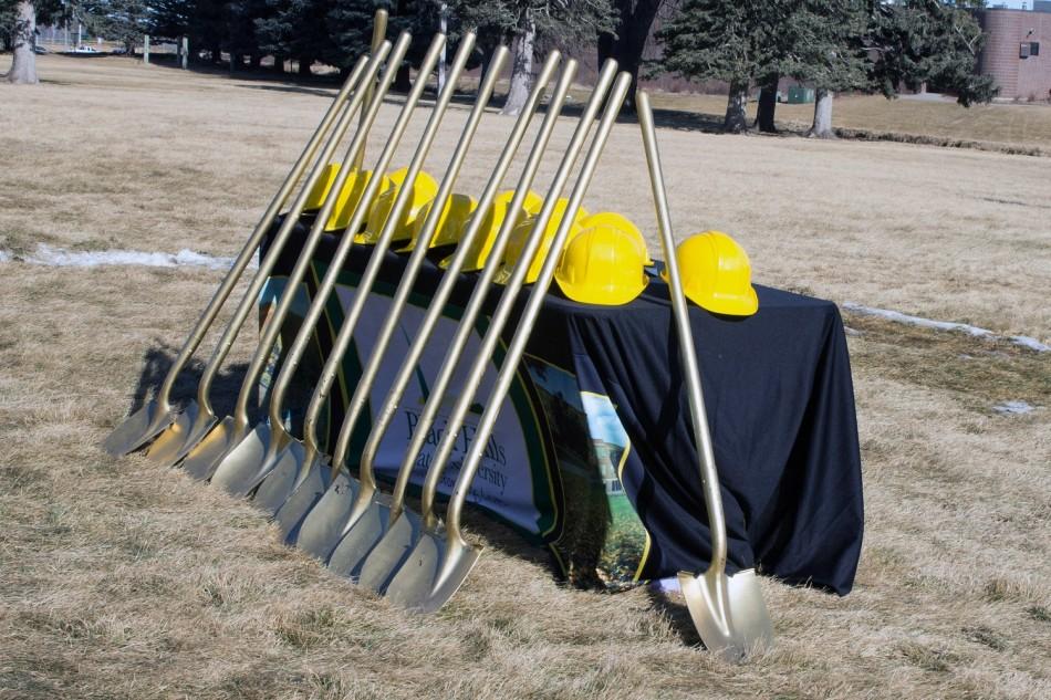 Yellow hard hats and gold shovels await to be used for the ground breaking ceromony on Feb 14th for the new resident hall on BHSU campus.