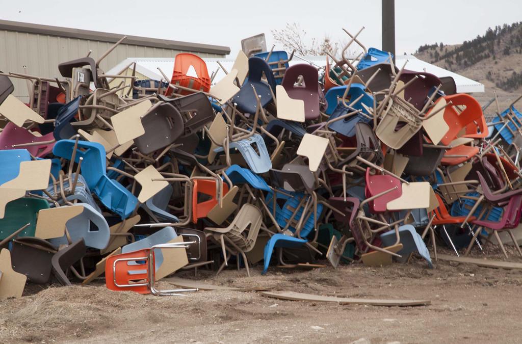 A pile of old desks from Jonas Hall after the remodel. 