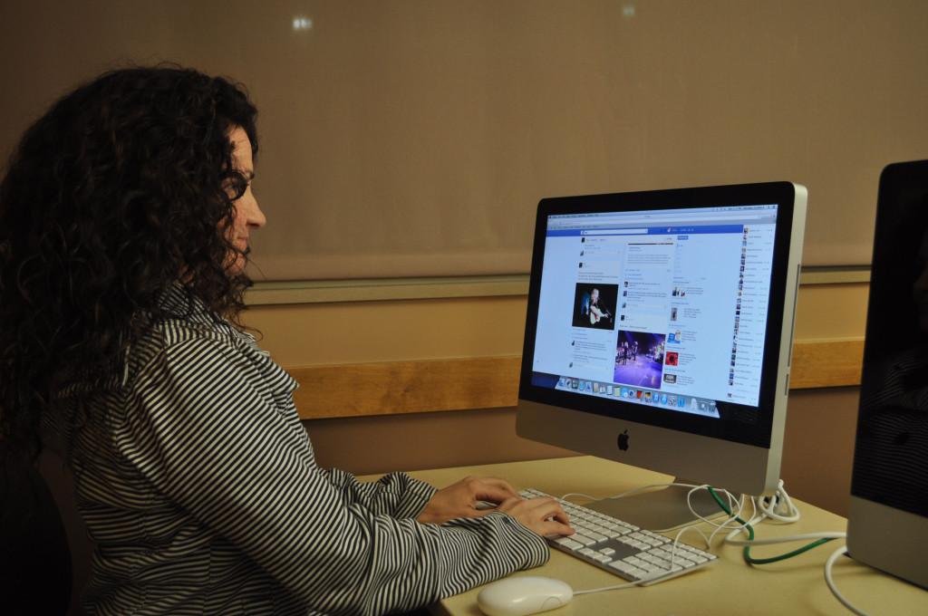 While waiting for class to start Cynthia Herndon uses her free time at the University Center Rapid City mac lab to get onto Facebook. I asked her what does she use Facebook for? “I dont use Facebook, I abuse Facebook. she said.