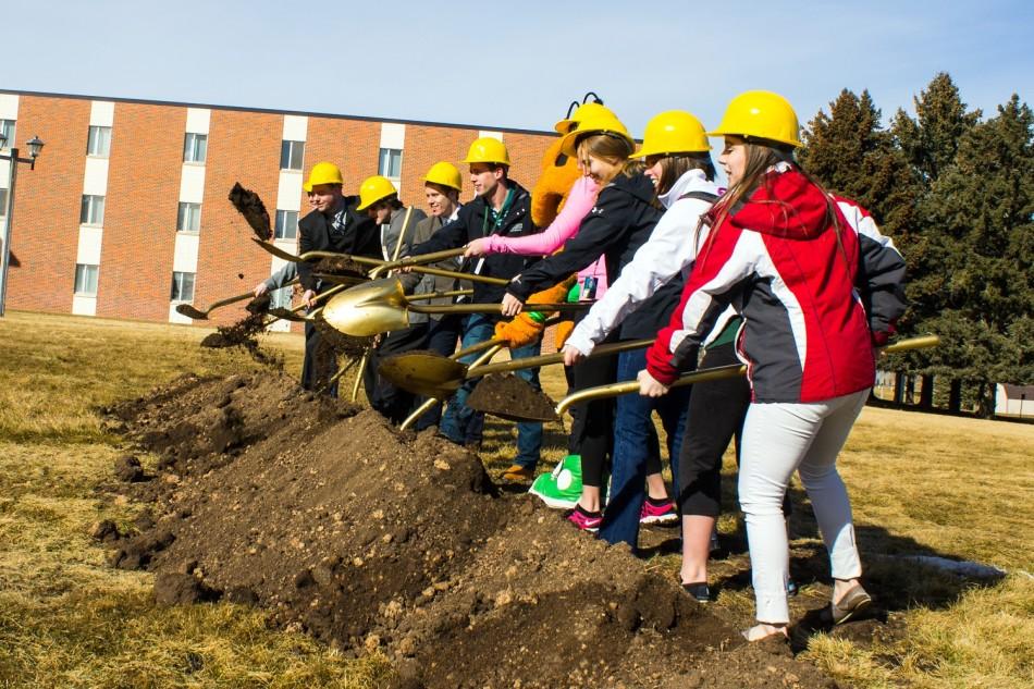 Students help out at the new resident halls ground breaking ceremony on Feb 14th