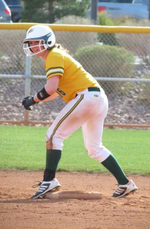 Female softball player getting ready to run. 