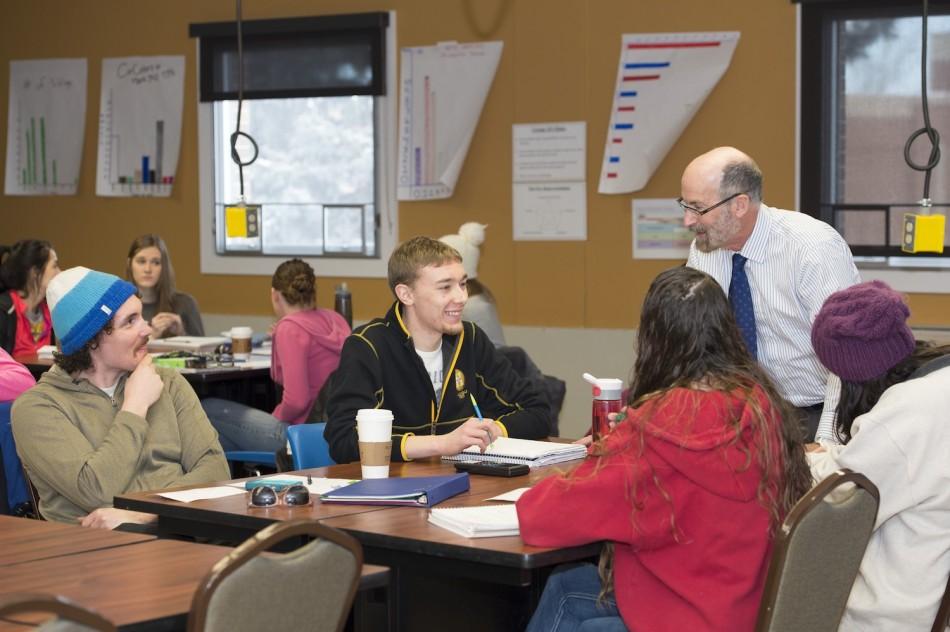 Dr. John Alsup, professor of math education, speaks with students in his Math Concepts for Teachers II class at Black Hills State University, Feb. 25, 2014.