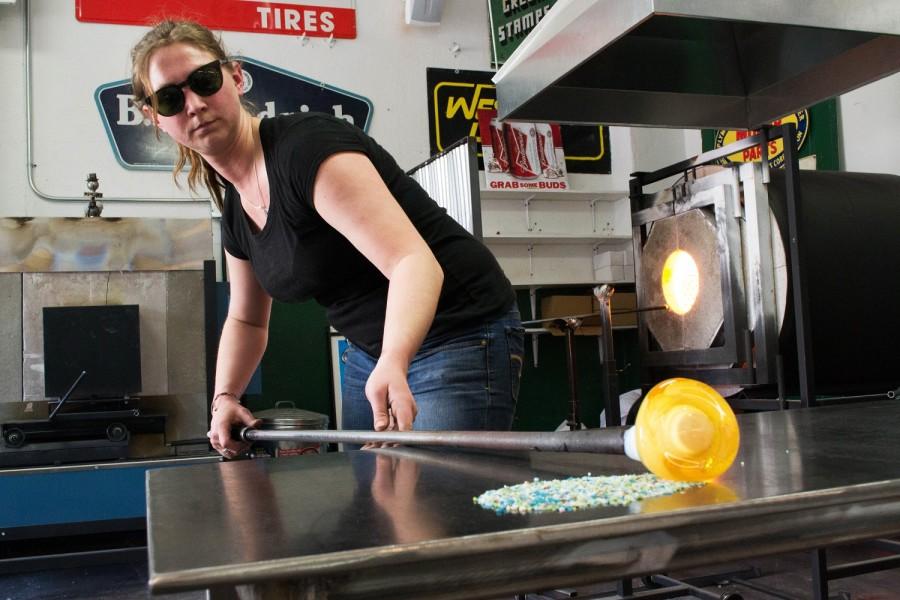 Studio owner, Toni Gerlach adds color to glass in preparation of making a seashell at the Pump House April 15 in Deadwood, S.D. 