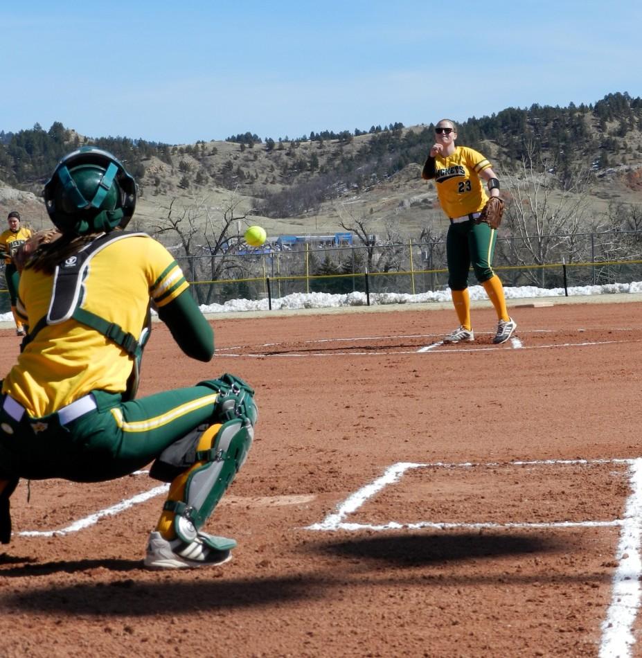 Pitcher Kaitlin Farrar warming up with catcher Sara Schmid