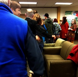 Audience members congratulate the cast of
