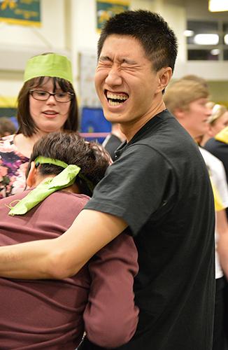 Peter Xing Ao of Pangburn hall works to thaw a frozen t-shirt during the All-Hall Battle in the Young Center.