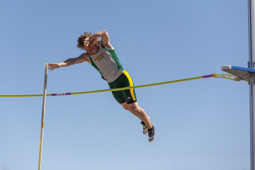 Ryan Mehalick clears the bar during the men's pole vault event.