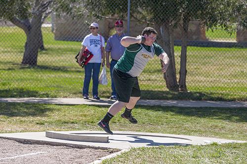Laketon McLaughlin winds up to throw the shot put during the men's shop put event.