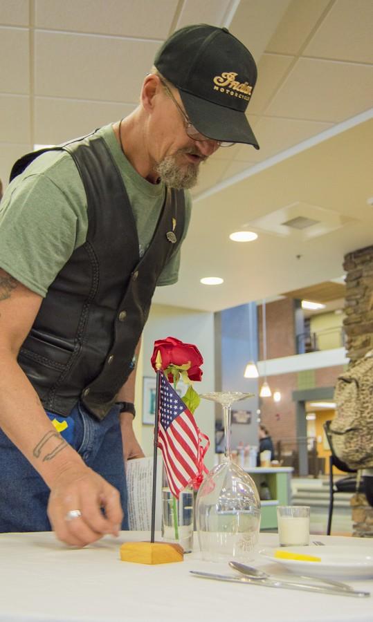 Veterans’ Club member Steve Weir puts the finishing touches on the Missing Man table in the Student Union Sept. 17 in observance of National POW/MIA Recognition Day. The table and its elements are put in place to honor and remember fallen, missing, or imprisoned military members