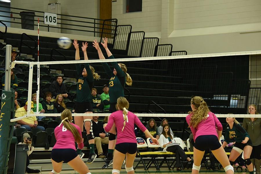 Brynn Eckhardt and Jessy Hibl jump up to block against Fort Lewis. The Yellow Jackets went on to win the series Oct. 23 at the Young Center.