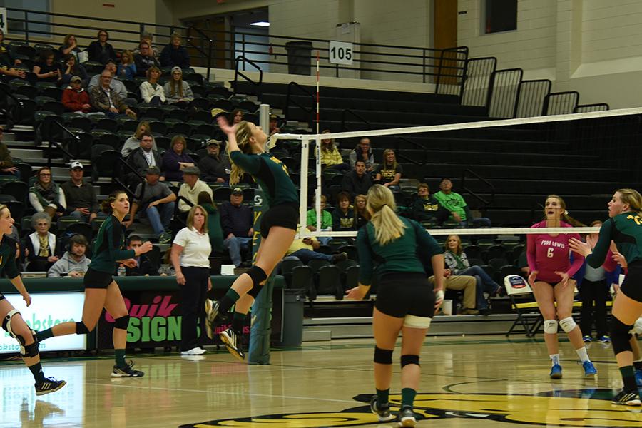 Ellise Lech spikes the volleyball against Fort Lewis. The Yellow Jackets went on to win the series Oct. 23 at the Young Center.