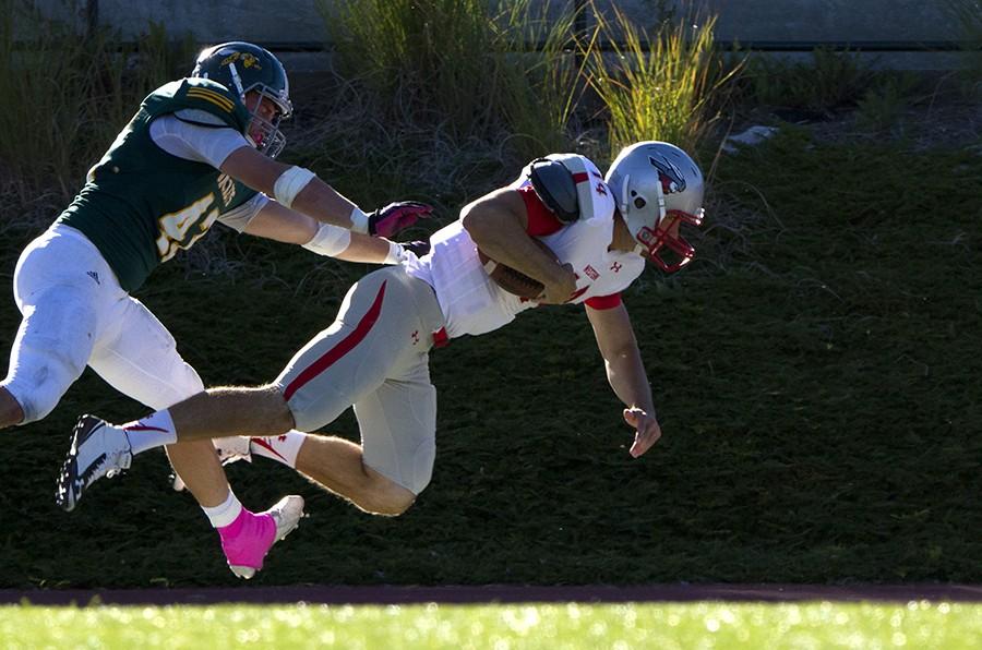 Thayer Sauter takes down Western State Colorado’s Cameron Shumway during Swarm Week’s Oct. 10 game.
