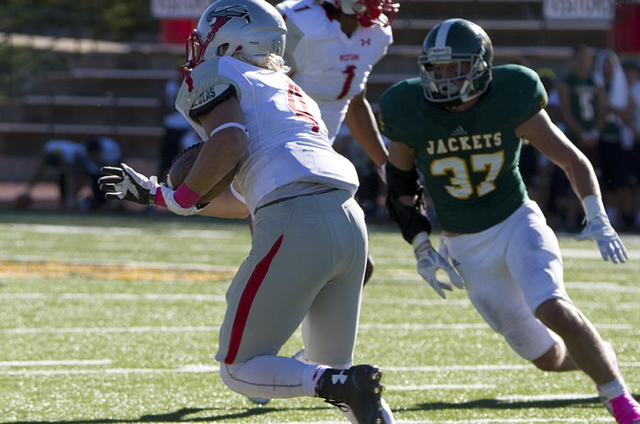 Safety Travis Groves goes after Western State Colorado's Zach Griggs during Swarm Week's Oct. 10 game.