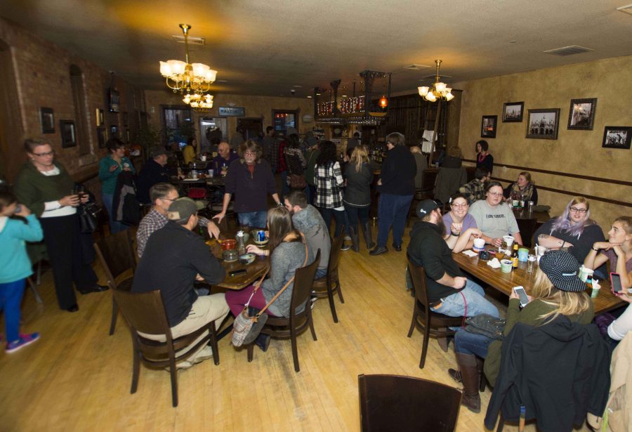  
Community members, college students, and professors gather for the annual Empty Bowls fundraiser and silent auction Oct. 19 at the Deadwood Social Club. 
