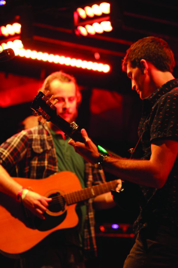 Band members Nick Huster and Jake Ryan perform side by side during a show. photo retrieved from www.mightybrother.com