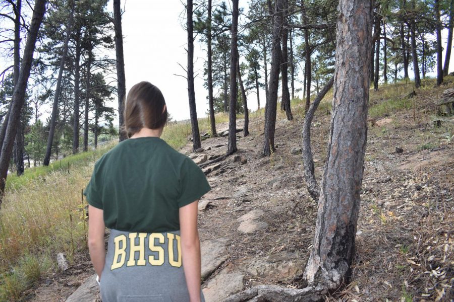 Freshman, Anita Akers, enjoys the nice weekend weather in Rapid City with a hike up M Hill.