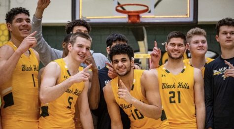 Joel Scott (left), Sava Dukic (left), and BHSU basketball celebrate conference championship. Photo by Jeff Codevilla