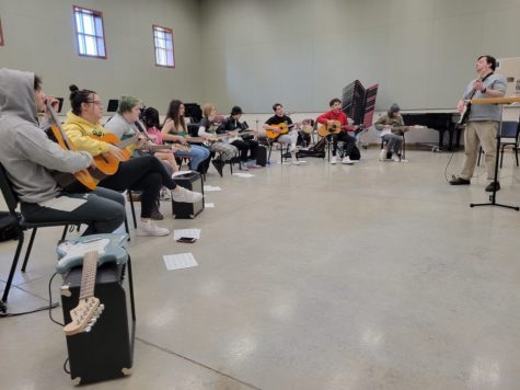 Students practice guitar in Dr. Berberick’s Music Appreciation class. Photo by Jacob Jones