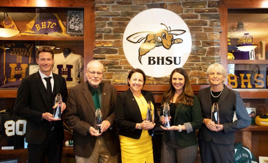 From left to right: Dr.  Nathan Steinle, Receipient of the Special Acheivement Award, Dr. David A. Wolff, Special Service Award, Col. Stacy L. (Trezona) Goodman, Distinguished Alumna Award, Ashley (Grable) Hunter, Young Alunmi Achievement Award, and Chris Haines, Excellence in Education Award. 