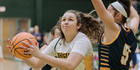 Alessia Capley taking on Regis University in a 71-64 win at home.