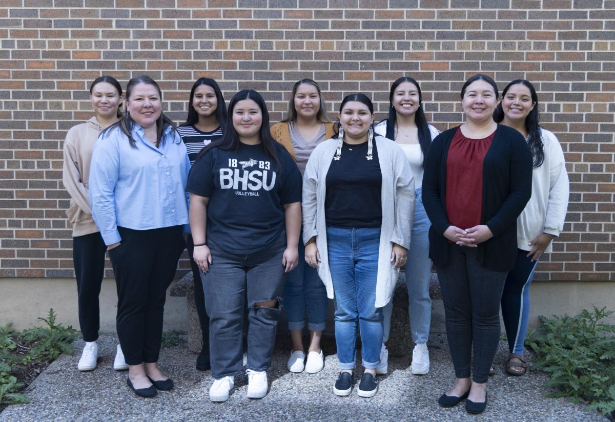 Members of Lakota Omniciye pose with advisers Urla Marcus and Rosie Sprague.