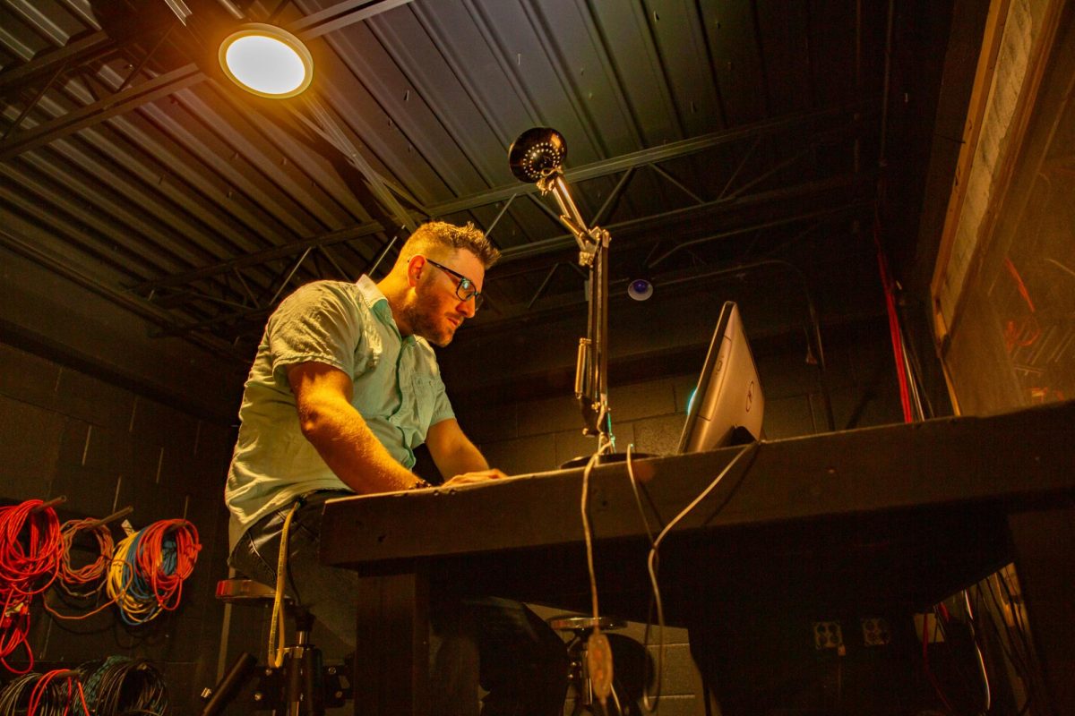 BHSU Theature Director Casey Hibbert adjusts the stage lights in the Black Box theatre