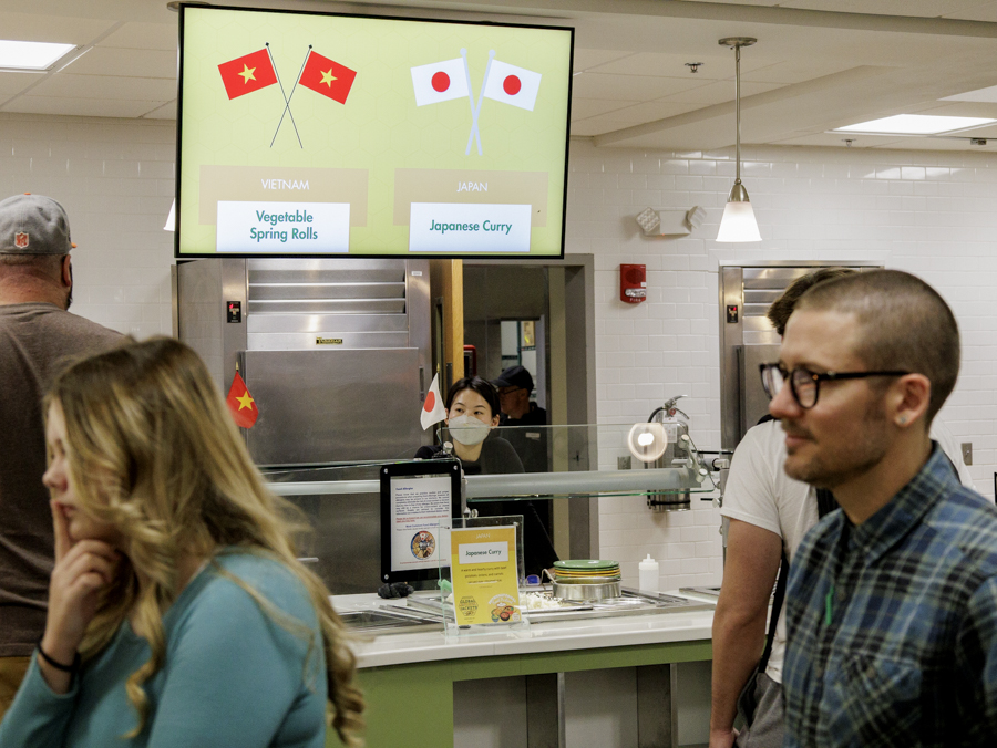 BHSU International student serves food at the International Food Festival.